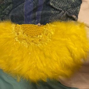 An African wedding /party feather hand fan yellow color